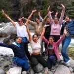 Himalayan Ecotourism's women trek staff by the Tirthan river